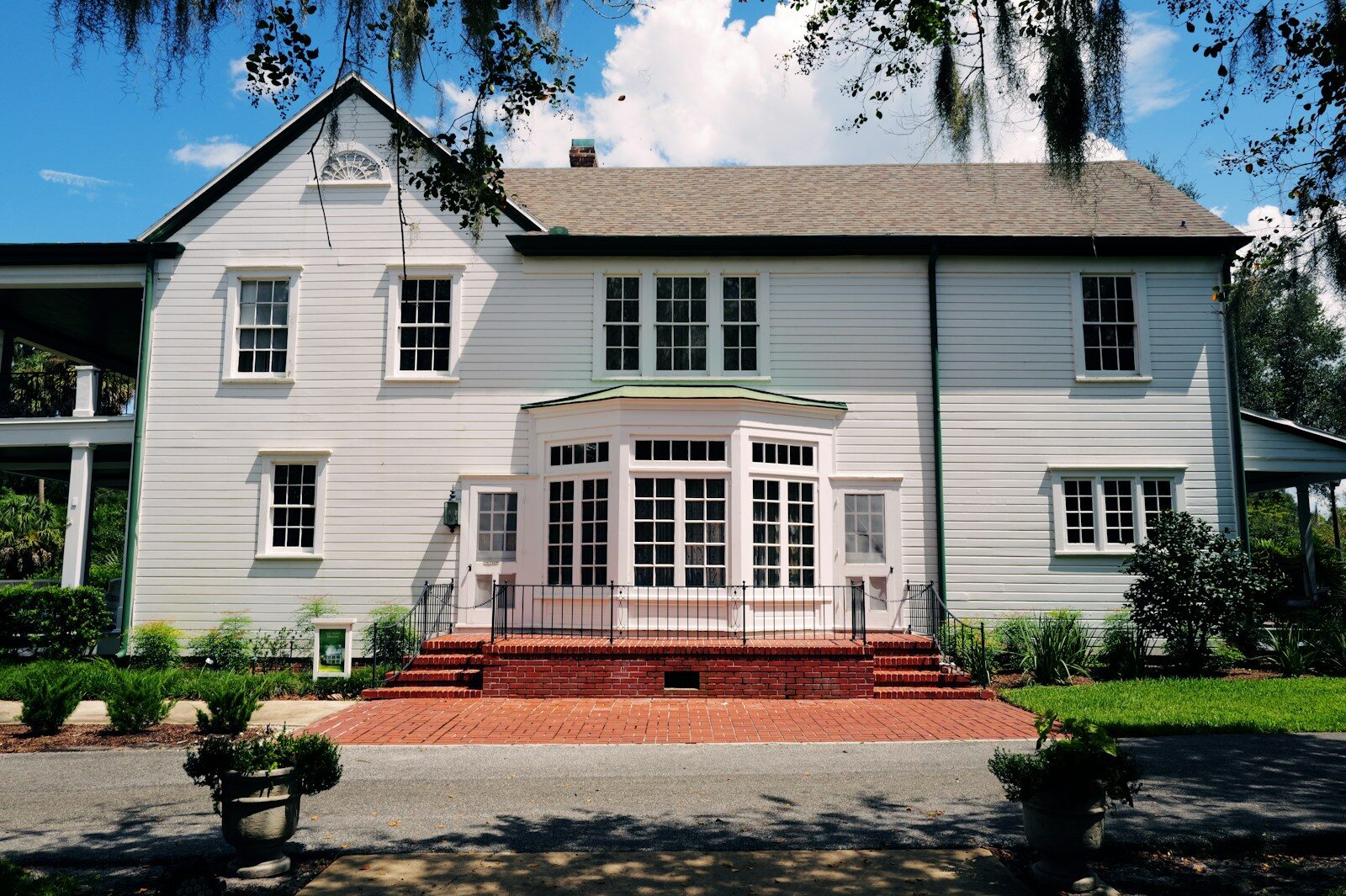 A large white house with a large front porch